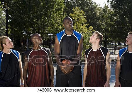 Five basketball players in a line View Large Photo Image Stock Image - Five basketball players in a line. Fotosearch
