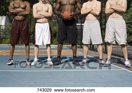 Five basketball players in a row, mid and low section View Large Photo Image Stock Photo - Five basketball players in a row, mid and low section. Fotosearch
