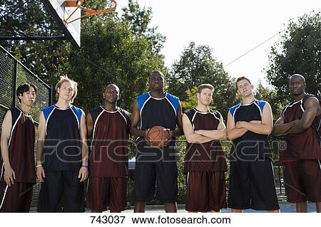 Stock Photo - Seven basketball players in a row. Fotosearch