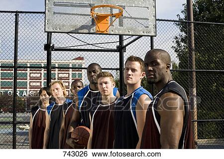 Stock Photograph - Seven basketball players in a row. Fotosearch