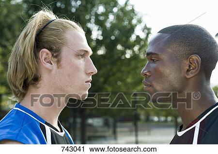 Two basketball players face to face View Large Photo Image Stock Image - Two basketball players face to face. Fotosearch