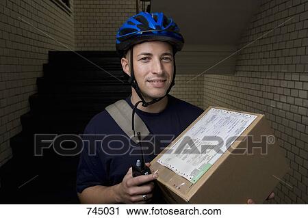 A bicycle messenger delivering a package View Large Photo Image Stock Image - A bicycle messenger delivering a package. Fotosearch
