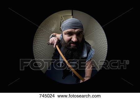 A biker breaking into a door with a crowbar, viewed through a peephole View Large Photo Image Picture - A biker breaking into a door with a crowbar, viewed through a peephole. Fotosearch