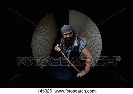A biker breaking into a door with a crowbar, viewed through a peephole View Large Photo Image Stock Photograph - A biker breaking into a door with a crowbar, viewed through a peephole. Fotosearch