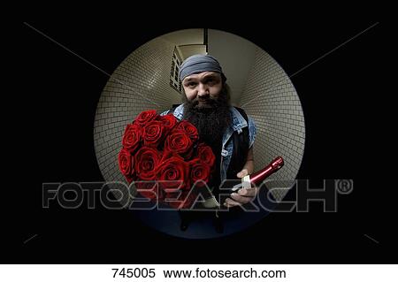 A man looking apologetic with roses and champagne viewed through a peephole View Large Photo Image Stock Photography - A man looking apologetic with roses and champagne viewed through a peephole. Fotosearch