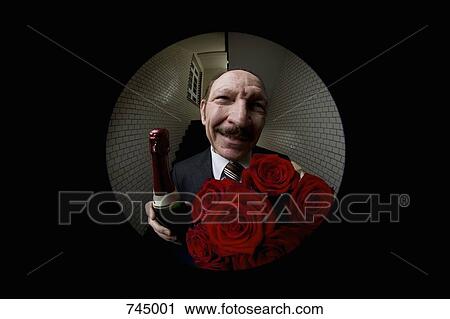 A man with roses and champagne viewed through a peephole View Large Photo Image Stock Image - A man with roses and champagne viewed through a peephole. Fotosearch