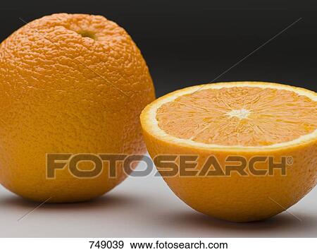 An orange and a half View Large Photo Image Stock Photo - An orange and a half. Fotosearch