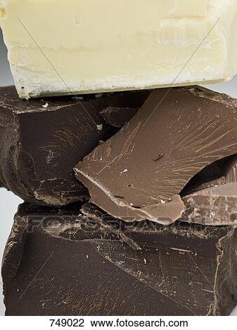 Pieces of dark, milk and white chocolate View Large Photo Image Stock Image - Pieces of dark, milk and white chocolate. Fotosearch