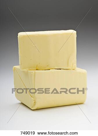 Two pieces of butter View Large Photo Image Stock Photo - Two pieces of butter. Fotosearch