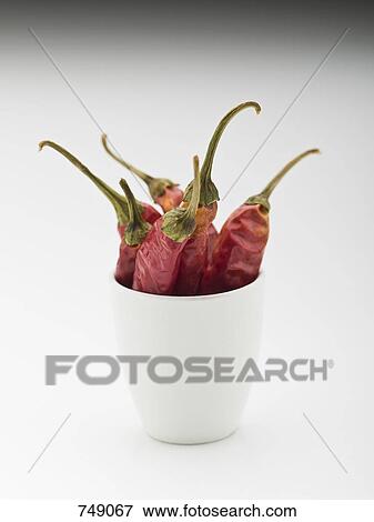 Whole dried red chilies in a cup View Large Photo Image Stock Photo - Whole dried red chilies in a cup. Fotosearch