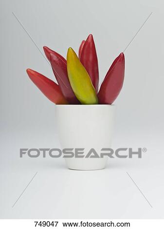 Whole fresh chilies in a cup View Large Photo Image Stock Photo - Whole fresh chilies in a cup. Fotosearch
