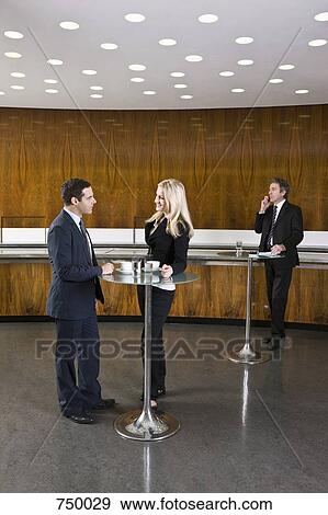 Business people in a cafe View Large Photo Image Stock Photo - Business people in a cafe. Fotosearch