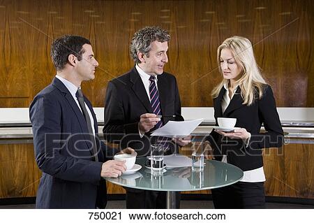 Business people meeting in a cafe View Large Photo Image Stock Image - Business people meeting in a cafe. Fotosearch