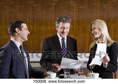 Business people meeting in a cafe View Large Photo Image Stock Photo - Business people meeting in a cafe. Fotosearch