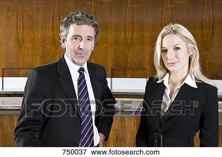 Stock Photo - Portrait of a businessman and businesswoman. Fotosearch
