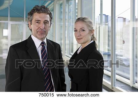Stock Photography - Portrait of a businessman and businesswoman. Fotosearch