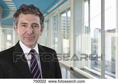 Portrait of a businessman View Large Photo Image Stock Image - Portrait of a businessman. Fotosearch