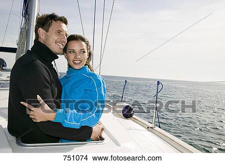A couple embracing on a yacht View Large Photo Image Picture - A couple embracing on a yacht. Fotosearch