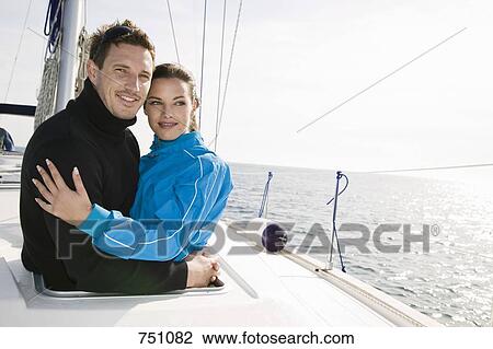A couple embracing on a yacht View Large Photo Image Stock Image - A couple embracing on a yacht. Fotosearch