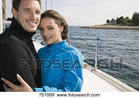 A couple embracing on a yacht View Large Photo Image Stock Photo - A couple embracing on a yacht. Fotosearch