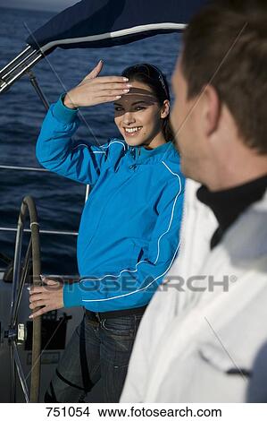 Picture - A couple on a yacht. Fotosearch