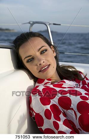 A woman relaxing on a yacht View Large Photo Image Stock Image - A woman relaxing on a yacht. Fotosearch