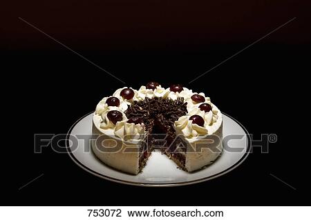 A cake on a plate with a slice missing View Large Photo Image Stock Image - A cake on a plate with a slice missing. Fotosearch