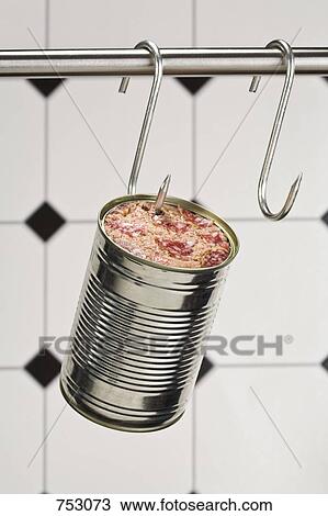 A can of meat hanging from a butchers hook View Large Photo Image Stock Image - A can of meat hanging from a butchers hook. Fotosearch