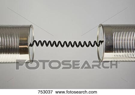 Stock Photo - A cord connecting two metal tins. Fotosearch
