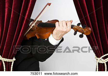 A man playing the violin View Large Photo Image Stock Image - A man playing the violin. Fotosearch