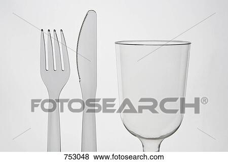 A plastic knife and fork and a glass View Large Photo Image Stock Photo - A plastic knife and fork and a glass. Fotosearch