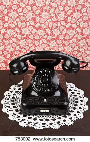 An old fashioned telephone on a dresser View Large Photo Image Stock Image - An old fashioned telephone on a dresser. Fotosearch