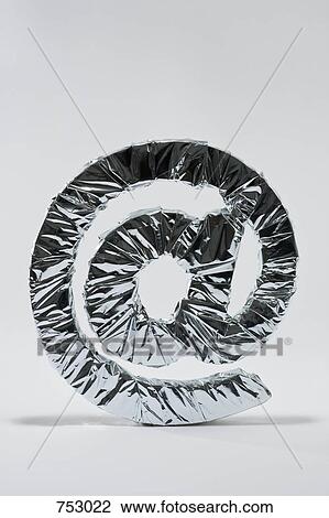 At sign wrapped in silver foil View Large Photo Image Stock Image - At sign wrapped in silver foil. Fotosearch
