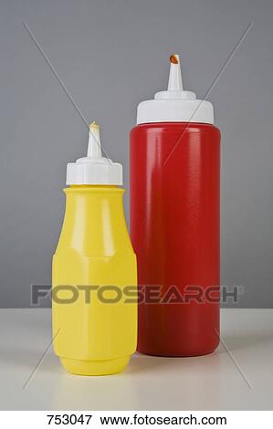 Ketchup and mustard bottles View Large Photo Image Stock Photo - Ketchup and mustard bottles. Fotosearch