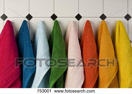 Multi colored towels hanging in a row on the wall View Large Photo Image Stock Image - Multi colored towels hanging in a row on the wall. Fotosearch