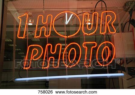 1 Hour Photo neon sign in a window View Large Photo Image Stock Photograph - 1 Hour Photo neon sign in a window. Fotosearch