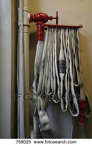 A fire hose View Large Photo Image Stock Photography - A fire hose. Fotosearch