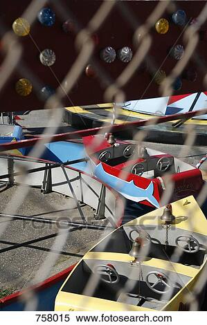 Stock Photography - A ride on boats at an amusement park. Fotosearch