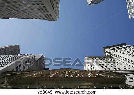Low angle view of the sky above Wall Street View Large Photo Image Stock Photo - Low angle view of the sky above Wall Street. Fotosearch