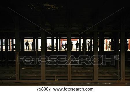 People waiting on a train platform View Large Photo Image Stock Photo - People waiting on a train platform. Fotosearch