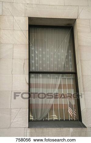 The American flag reflected in a window View Large Photo Image Stock Photograph - The American flag reflected in a window. Fotosearch
