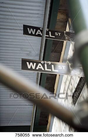 Stock Photography - Wall Street signs between scaffolding. Fotosearch