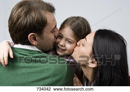 A daughter embracing her parents View Large Photo Image Stock Image - A daughter embracing her parents. Fotosearch