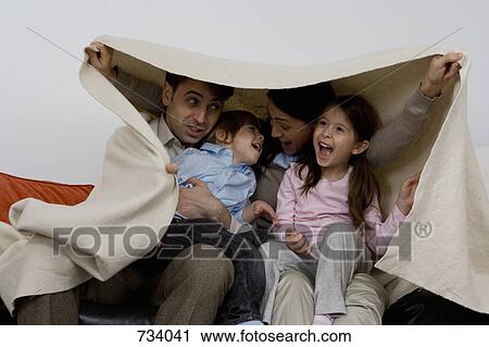 A family of four playing around View Large Photo Image Stock Image - A family of four playing around. Fotosearch