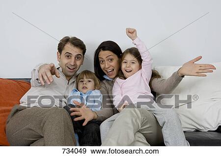 A family of four with excited expressions View Large Photo Image Stock Photo - A family of four with excited expressions. Fotosearch