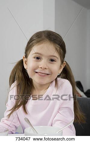 A girl with a milk moustache View Large Photo Image Stock Photo - A girl with a milk moustache. Fotosearch