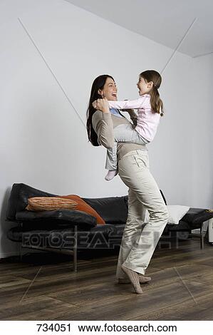 A mother and daughter being playful View Large Photo Image Stock Image - A mother and daughter being playful. Fotosearch