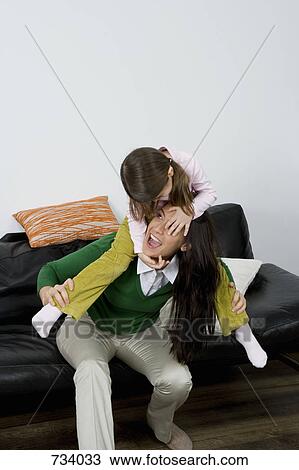 A mother and daughter playing View Large Photo Image Stock Image - A mother and daughter playing. Fotosearch