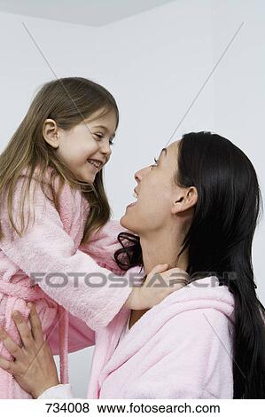 A mother and daughter wearing pink bathrobes View Large Photo Image Stock Photo - A mother and daughter wearing pink bathrobes. Fotosearch