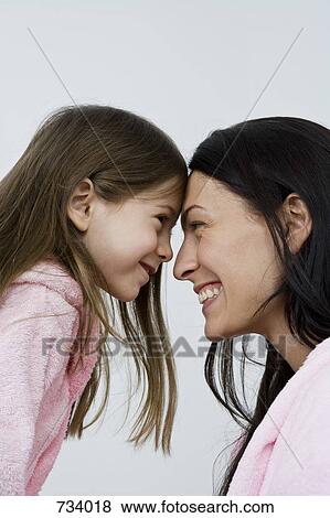 A mother and daughter wearing pink bathrobes View Large Photo Image Stock Photo - A mother and daughter wearing pink bathrobes. Fotosearch